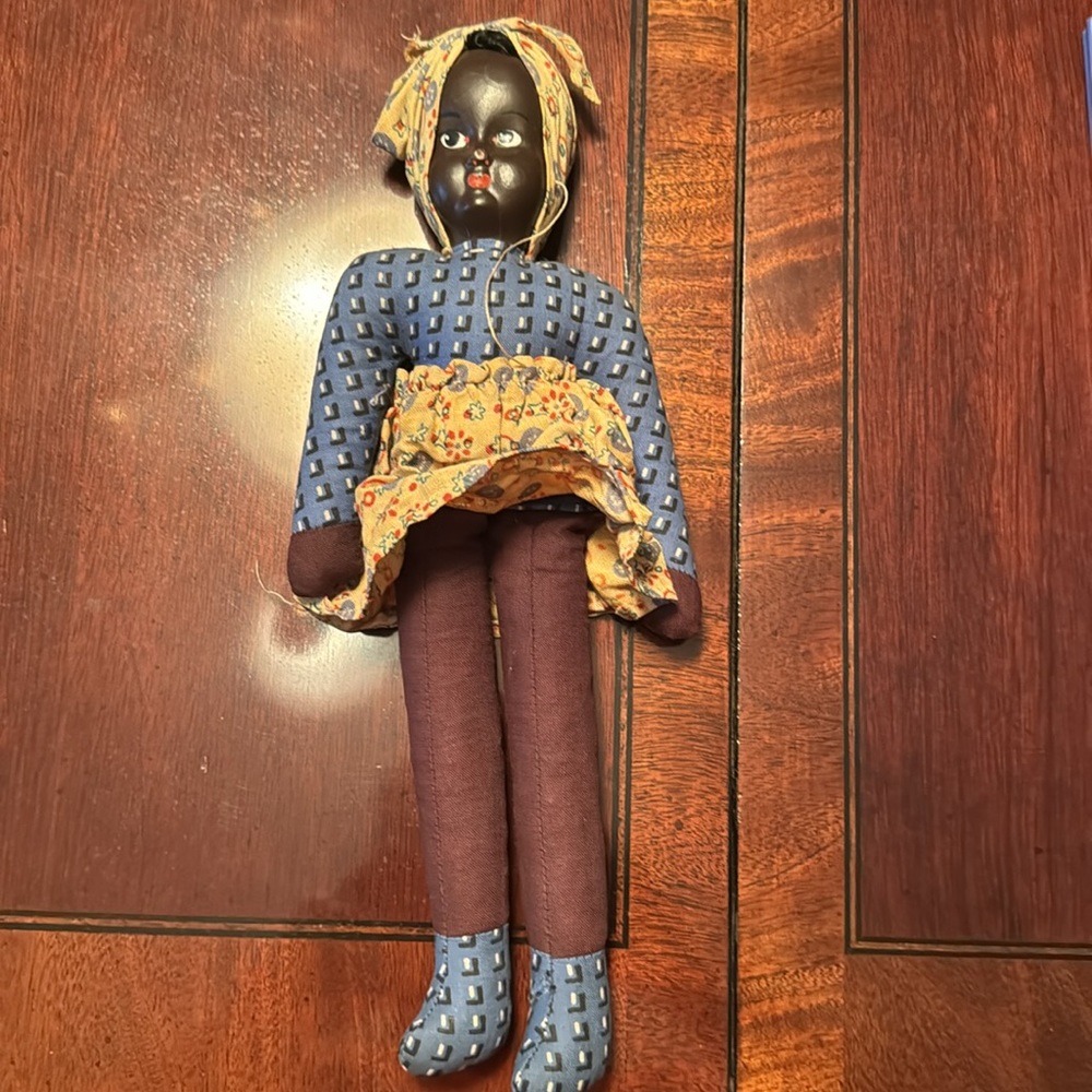 Handmade black polish doll